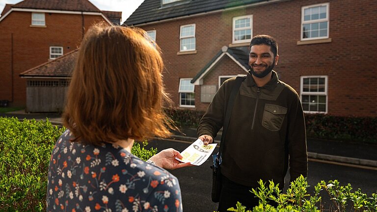 Prad delivering leaflet